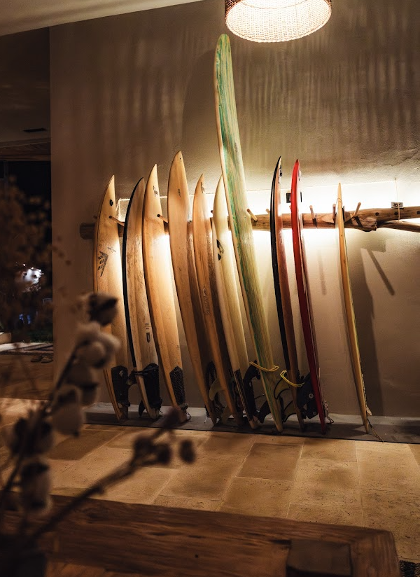 Surfboards lined along the wall at Selvamar